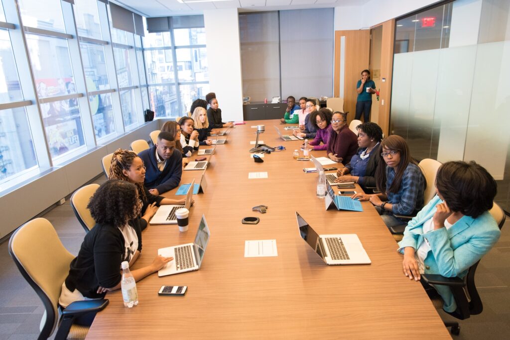 A table with business team members who have been combined using Physiotype's facial analysis in the most effective way possible using personality type.